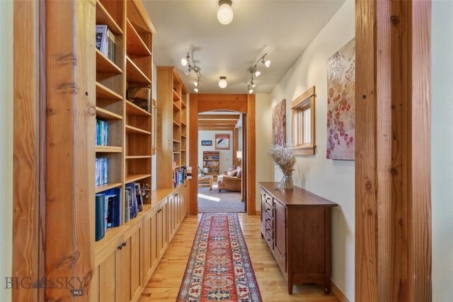 hall with light wood-type flooring