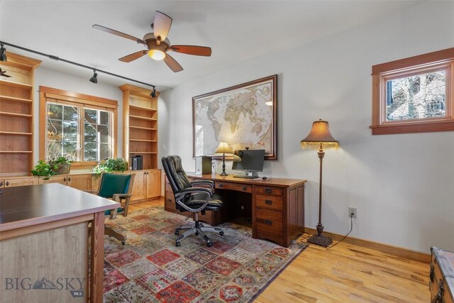 office with ceiling fan, plenty of natural light, and light hardwood / wood-style flooring