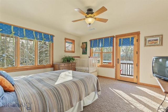 bedroom with ceiling fan, access to exterior, carpet, and multiple windows