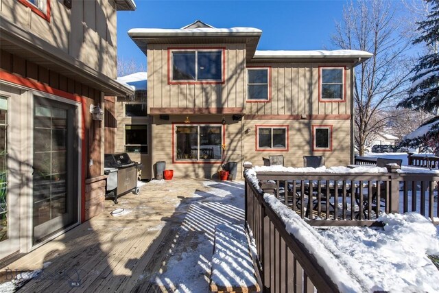 snow covered deck with area for grilling