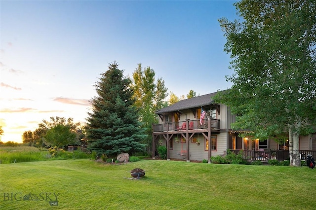 3213 Augusta Dr, Bozeman, MT 59715 - yard at dusk with a yard and an outdoor fire pit