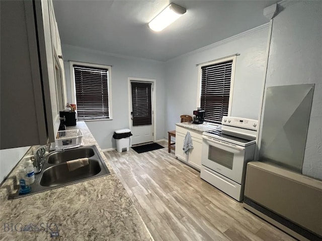 kitchen featuring light hardwood / wood-style floors, sink, white electric range oven, ornamental molding, and white cabinets