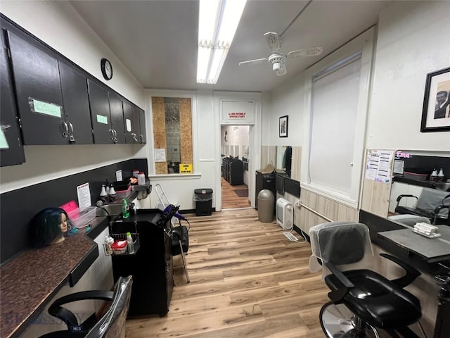 office with ceiling fan and light hardwood / wood-style floors