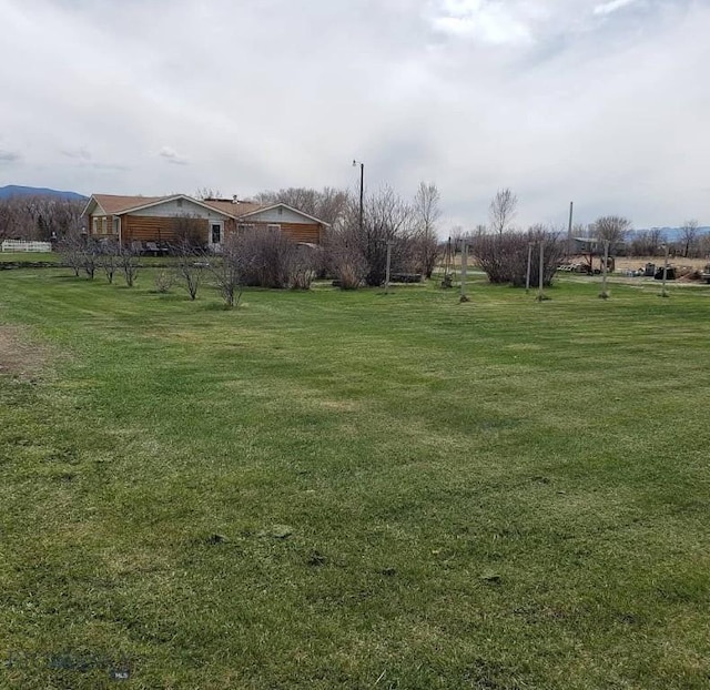 view of yard with a rural view