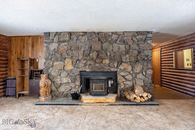 room details with carpet, rustic walls, wooden walls, and a wood stove