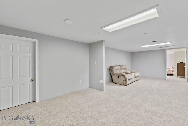 unfurnished room with light carpet