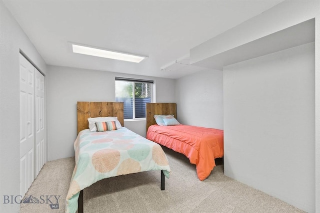 carpeted bedroom with a closet