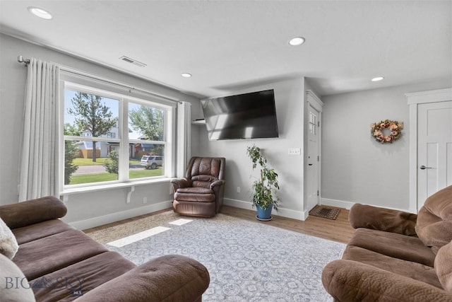 living room with light hardwood / wood-style floors