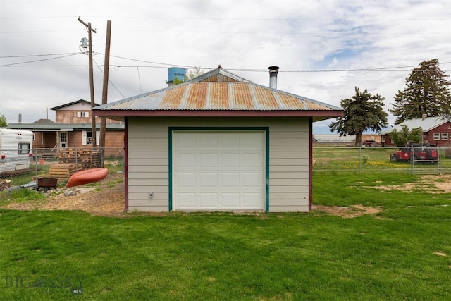 garage with a lawn