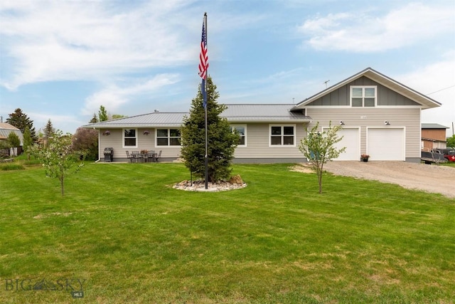 ranch-style home with a garage and a front lawn