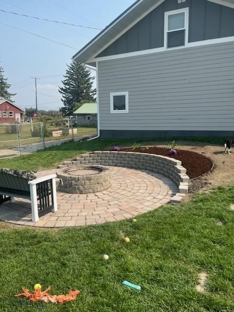 view of yard featuring a patio area and a fire pit