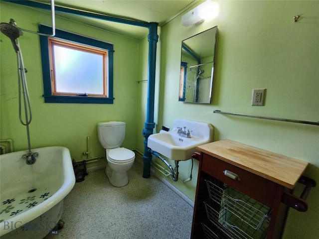 bathroom featuring toilet, sink, and a bathing tub