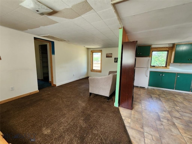 unfurnished living room featuring a healthy amount of sunlight