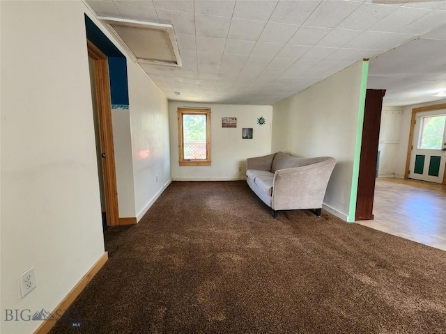 unfurnished room featuring dark colored carpet