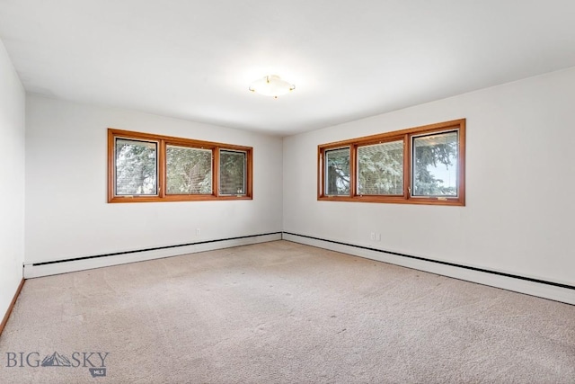 spare room featuring light colored carpet