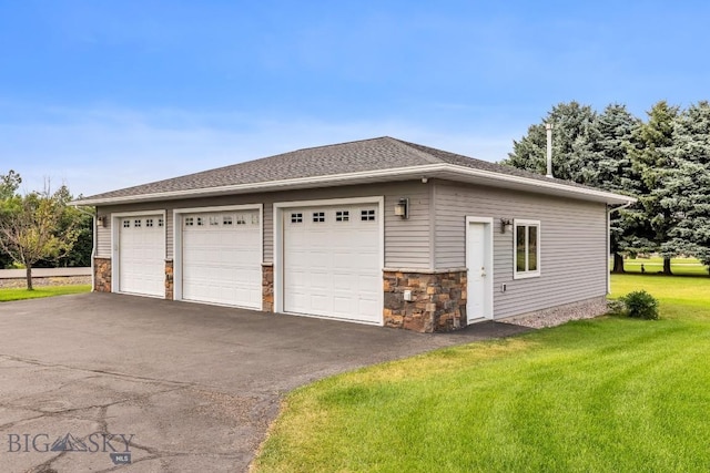 garage with a yard