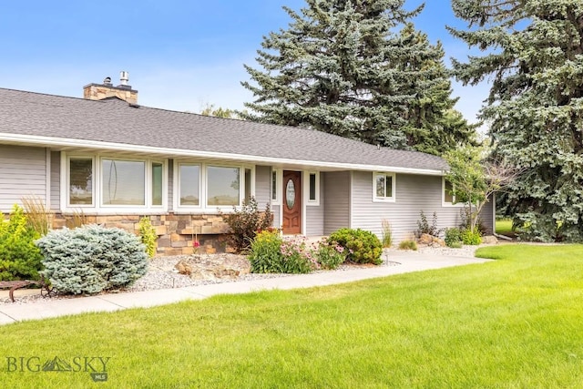 ranch-style house with a front lawn