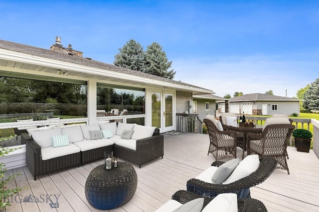 wooden terrace with an outdoor living space and french doors