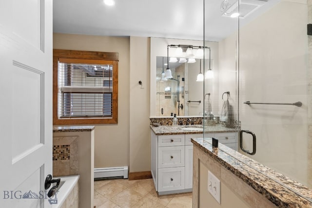 9 Park Plaza Rd, Bozeman, MT 59715 - bathroom featuring vanity, a baseboard radiator, a stall shower, and tile patterned flooring