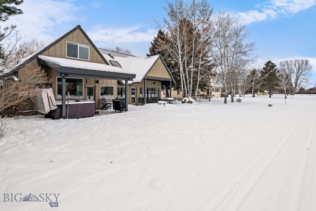 9 Park Plaza Rd, Bozeman, MT 59715 - snow covered property with board and batten siding and a jacuzzi