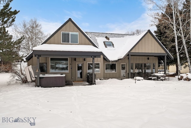 9 Park Plaza Rd, Bozeman, MT 59715 - snow covered back of property with a patio, board and batten siding, and a hot tub