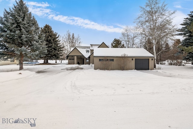 9 Park Plaza Rd, Bozeman, MT 59715 - view of front of house with board and batten siding and an attached garage