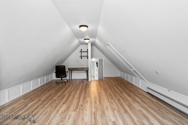 9 Park Plaza Rd, Bozeman, MT 59715 - unfurnished office with a baseboard heating unit, wood finished floors, and lofted ceiling
