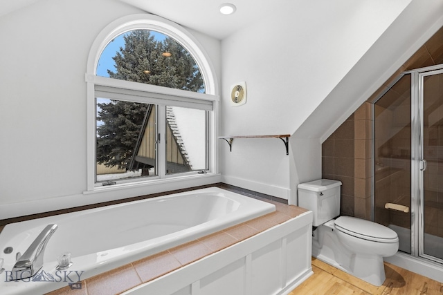 9 Park Plaza Rd, Bozeman, MT 59715 - full bathroom featuring toilet, wood finished floors, a bath, and a stall shower