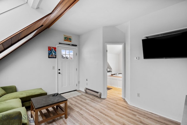 9 Park Plaza Rd, Bozeman, MT 59715 - living area with light wood-style floors, lofted ceiling, and a baseboard radiator