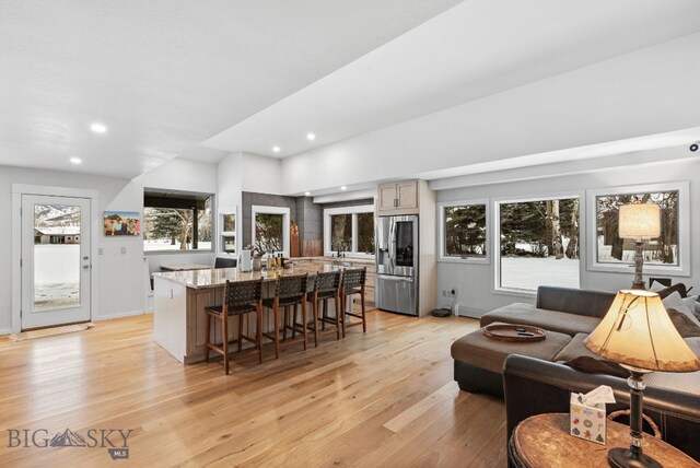 9 Park Plaza Rd, Bozeman, MT 59715 - living room with light wood finished floors, recessed lighting, and baseboards