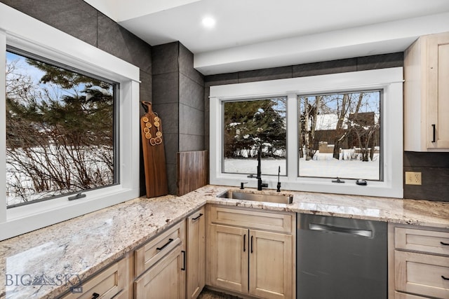 9 Park Plaza Rd, Bozeman, MT 59715 - kitchen featuring stainless steel dishwasher, a sink, light brown cabinets, and light stone countertops