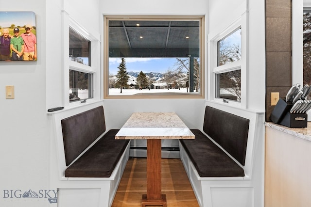9 Park Plaza Rd, Bozeman, MT 59715 - dining room featuring a baseboard heating unit, wood finished floors, and breakfast area