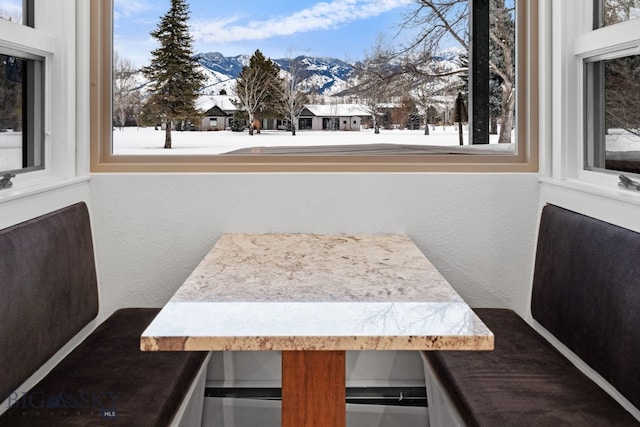 dining room featuring a mountain view