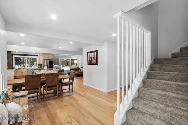9 Park Plaza Rd, Bozeman, MT 59715 - dining room featuring light wood finished floors, stairs, recessed lighting, and baseboards