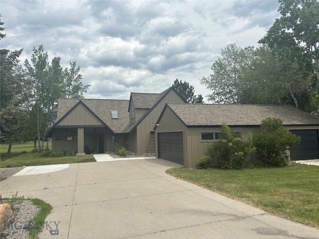 9 Park Plaza Rd, Bozeman, MT 59715 - view of front facade featuring a front yard, a shingled roof, an attached garage, and concrete driveway