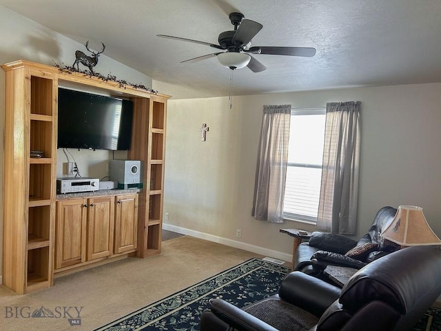 living room featuring ceiling fan and carpet floors