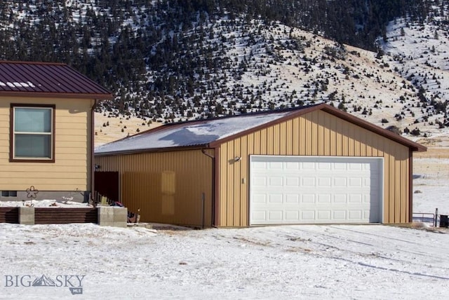 view of snow covered garage