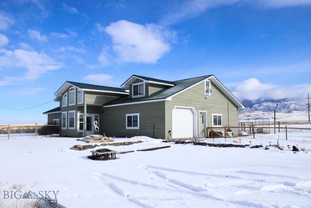 4008 Mt Highway 287, Twin Bridges, MT 59754 - view of snow covered exterior with an outdoor fire pit and fence