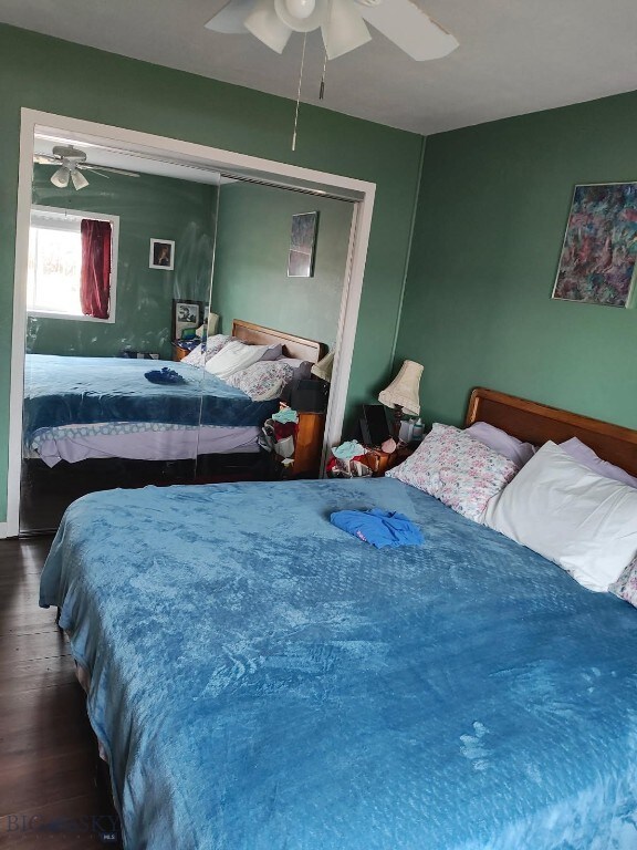 bedroom featuring a closet, a ceiling fan, and wood finished floors