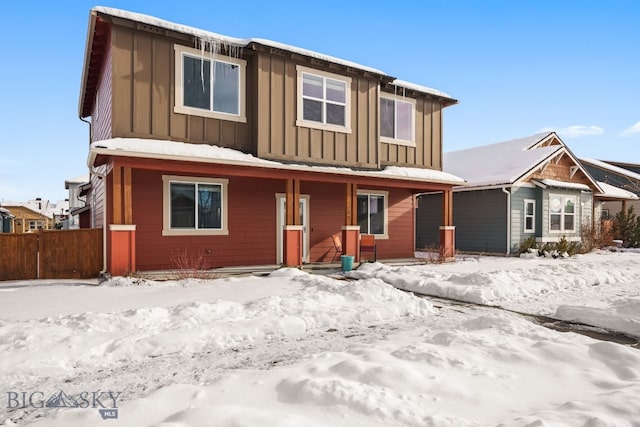 view of front of house featuring board and batten siding, covered porch, and fence