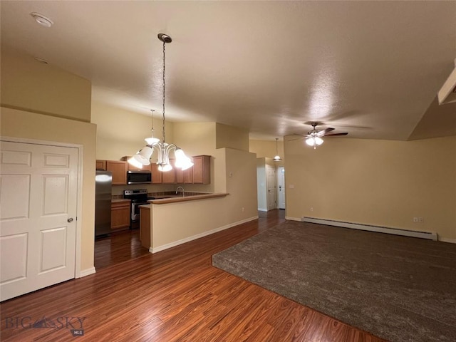 unfurnished living room with dark hardwood / wood-style flooring, sink, ceiling fan with notable chandelier, and a baseboard radiator