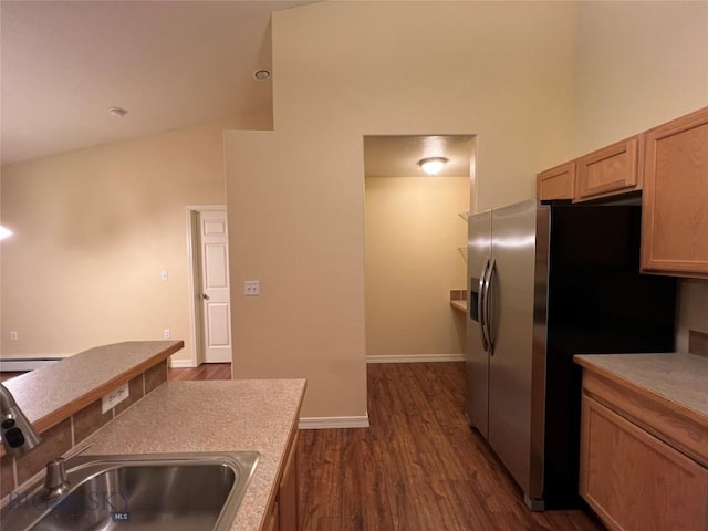 kitchen featuring sink, light brown cabinets, stainless steel fridge with ice dispenser, and dark hardwood / wood-style flooring