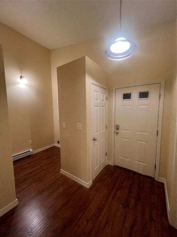 entryway with a baseboard heating unit and dark hardwood / wood-style floors