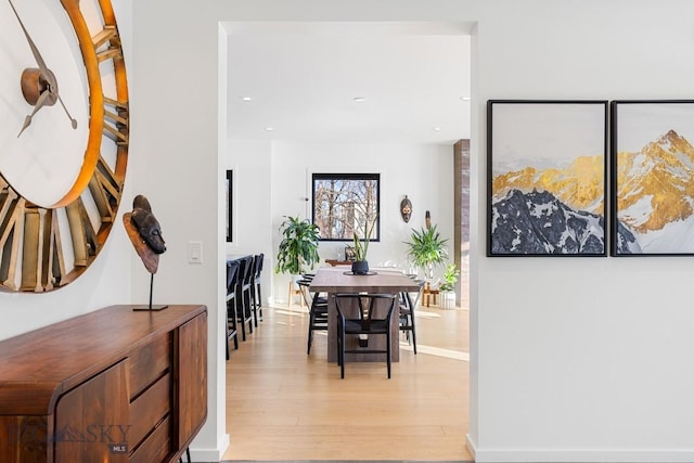 hall with light hardwood / wood-style floors