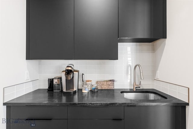 kitchen featuring sink and tasteful backsplash