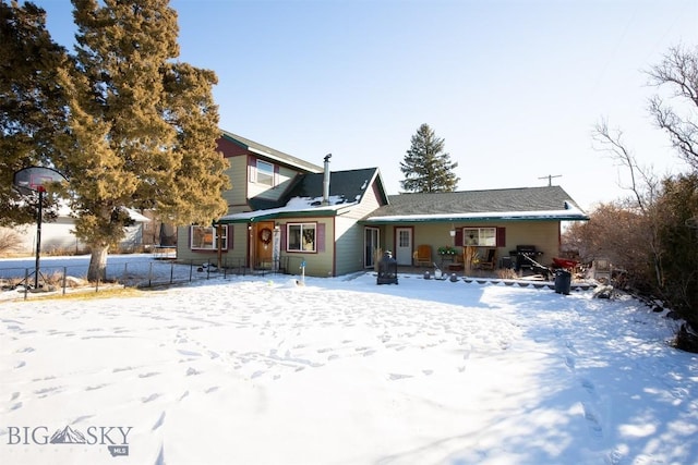 view of snow covered house