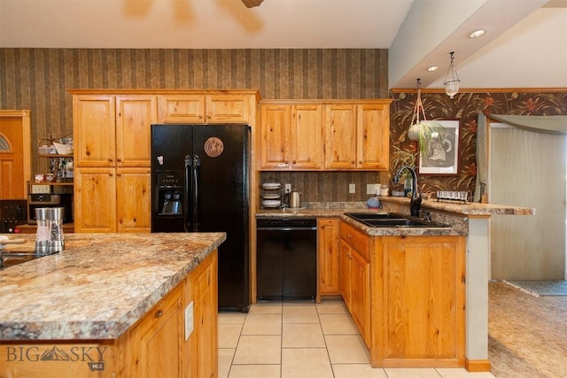 kitchen featuring light tile patterned floors, a kitchen island, sink, and black appliances