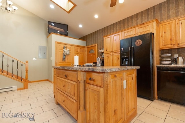 kitchen featuring light tile patterned floors, a center island with sink, black appliances, baseboards, and wallpapered walls