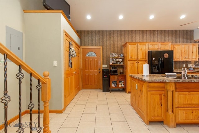 kitchen with light tile patterned floors, black appliances, recessed lighting, and wallpapered walls