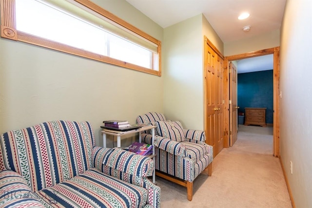 living area featuring carpet floors